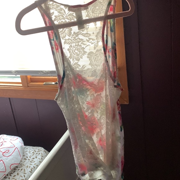 This is a flower women top with mesh on the back - Picture 2 of 2